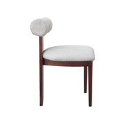 A modern dining chair featuring a dark brown wooden frame and legs, with a light beige textured boucle upholstered seat and a matching cylindrical backrest, shown against a plain white background.