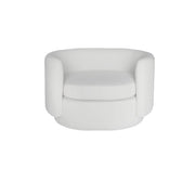 A modern beige velvet-style armchair with a rounded, low-profile silhouette and thick cushioned seat, shown against a plain white background.