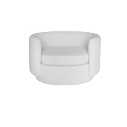 A modern beige velvet-style armchair with a rounded, low-profile silhouette and thick cushioned seat, shown against a plain white background.
