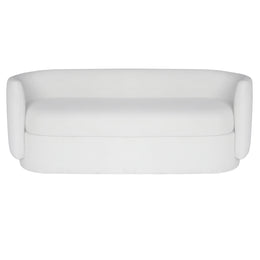 A modern beige velvet upholstered loveseat sofa with rounded arms and a low rounded base, shown against a plain white background.