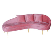 A curved pink velvet bridal sofa with three matching back cushions and slim gold metal legs, shown against a plain white background.