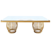 Dinning table with glass top and rattan base on a white background