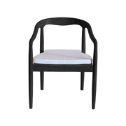 Black chair with a white cushion on a white background