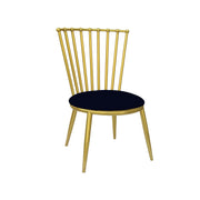 Gold metal chair with a black cushion on a white background