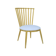 Gold metal chair with a white cushion on a white background
