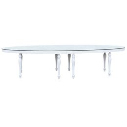 Round glass dining table with white legs on a white background moments Rentals