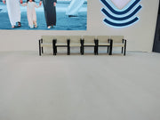Modern interior with a screen displaying people by the water and a logo on the wall.