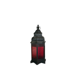 Decorative lantern with red glass on a white background