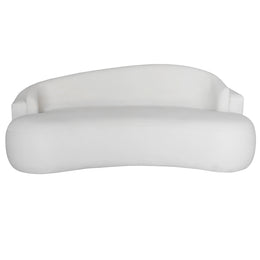 A modern curved beige sofa with a low back and wide armrests, shown against a plain white background.