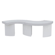 A modern curved bench with a textured white top and three cylindrical pedestal legs, shown against a plain white background.