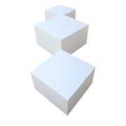 Three white square coffee tables on a white background