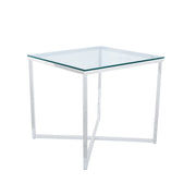Glass top table with white metal frame on a white background