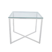 Glass side table with white metal frame on a white background