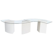 Modern glass dinning table with white base on a white background