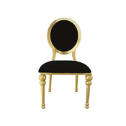 Chair with black seat and backrest and gold frame on a white background