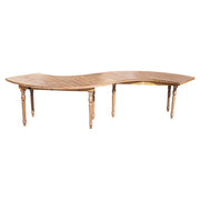 Wooden dining table with curved design on a white background